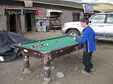 Tibet Kailash 08 Kora 07 Darchen Playing Pool Pete and I walked outside and enjoyed a few games of pool as Tibetans looked on. They especially cheered when Pete made a great shot. The next morning Pete remarked, �When I woke up I thought I was in my own bed. But then I realized, �Oh crap, I�m in Darchen� �.